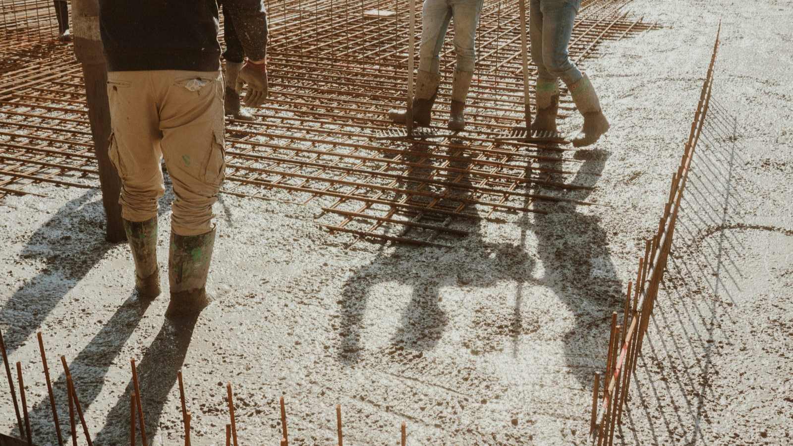 Reinforcing steel tied out in a grid over a compacted base, ready for a slab pour